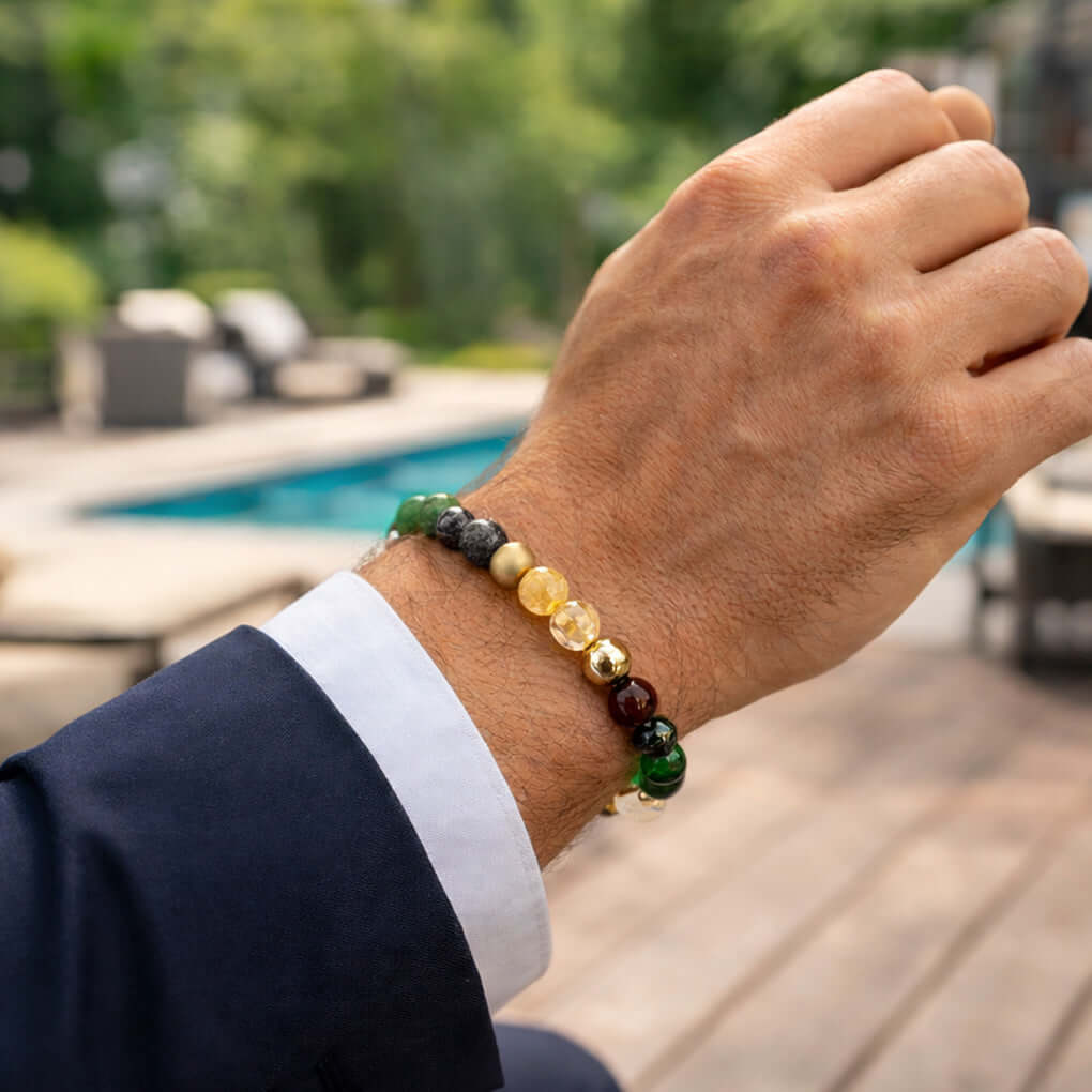 Dhan Yog Magnet Bracelet worn on a man's wrist outdoors, enhancing style and energy.