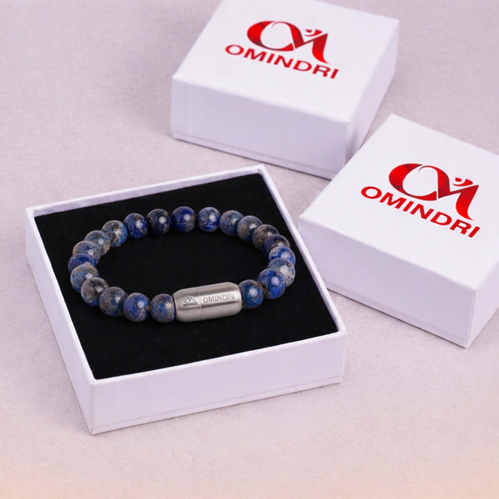 Magnet Lapis Lazuli Bracelet displayed in an elegant box by Omindri, showcasing its vibrant blue stones.