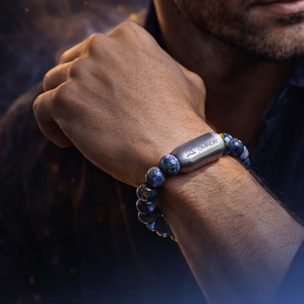 Man wearing a Magnet Lapis Lazuli Bracelet featuring natural Lapis Lazuli stones and magnetic elements.