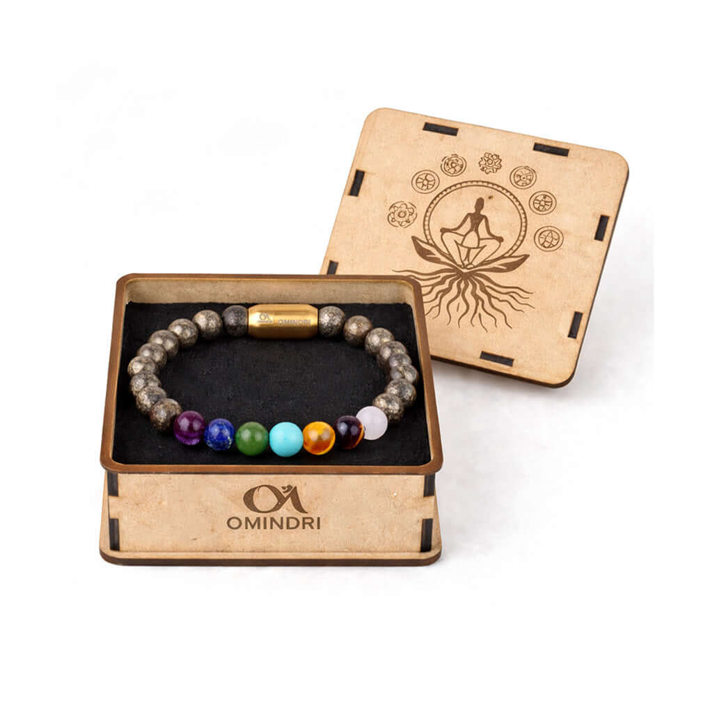 Magnet 7 Chakra With Pyrite Bracelet in wooden box by Omindri, featuring seven chakra stones and pyrite.