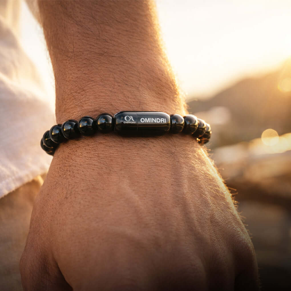 Magnet Black Obsidian Bracelet worn on a hand, showcasing its natural stones and stylish design.