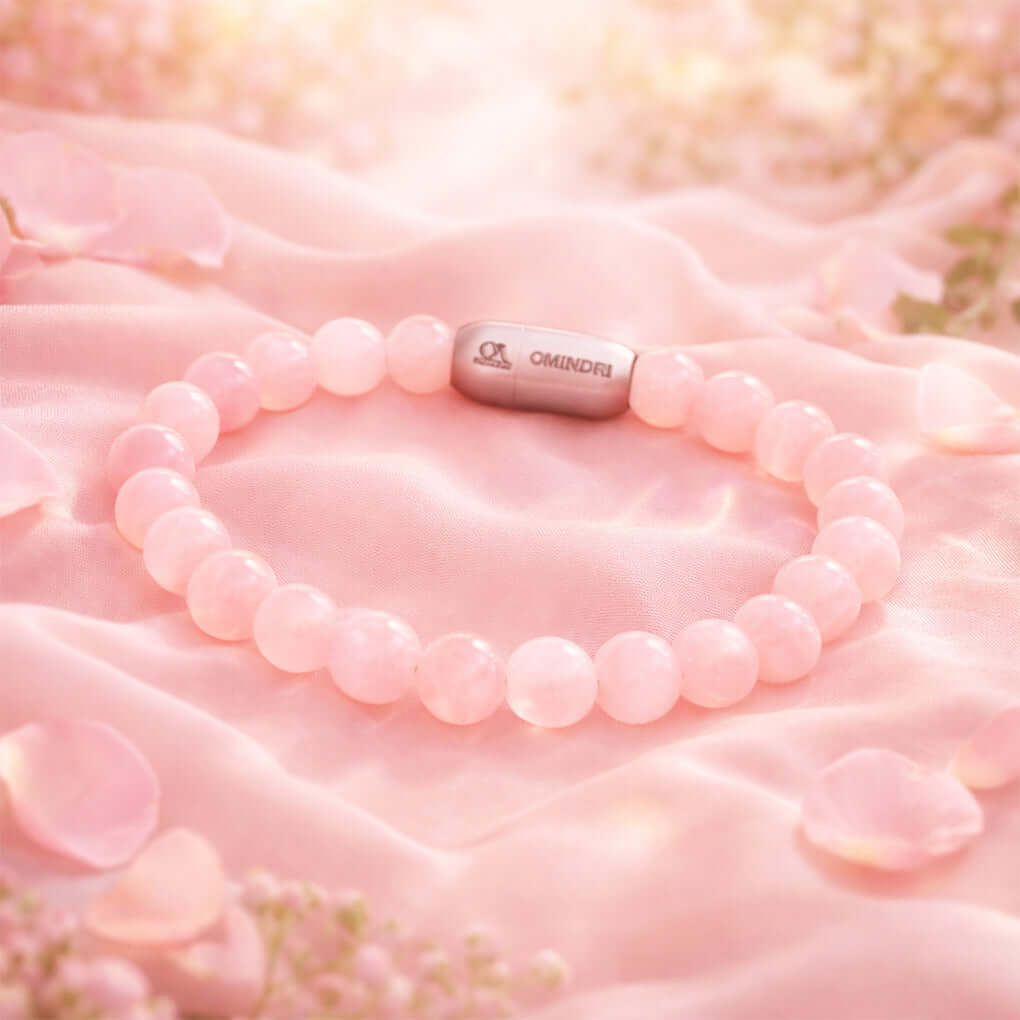 Magnet Rose Quartz Bracelet featuring natural rose quartz stones on a soft pink background.