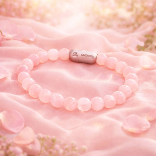 Magnet Rose Quartz Bracelet featuring natural rose quartz stones on a soft pink background.