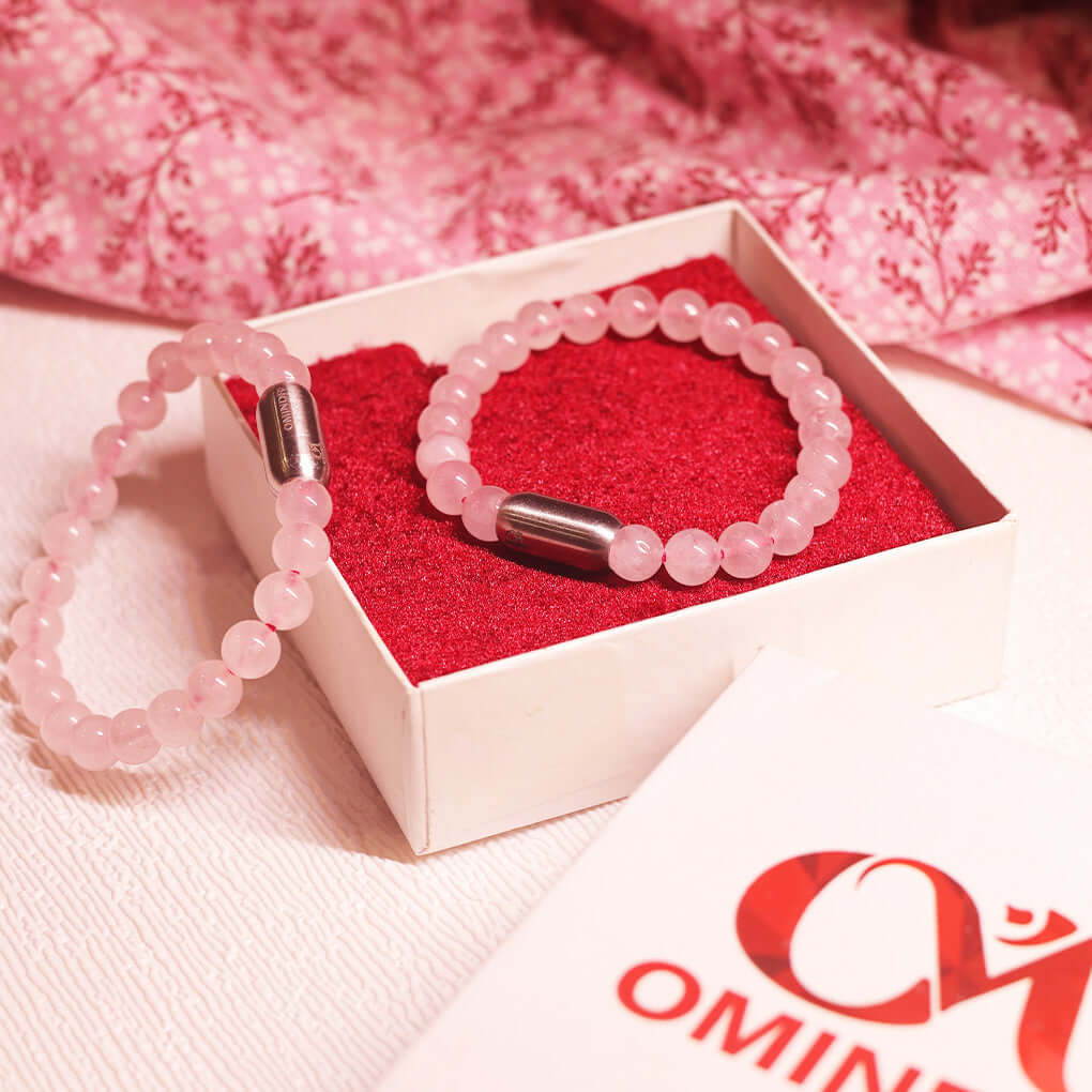 Magnet Rose Quartz Bracelet displayed in a box, featuring soft pink natural stones and elegant silver accents.