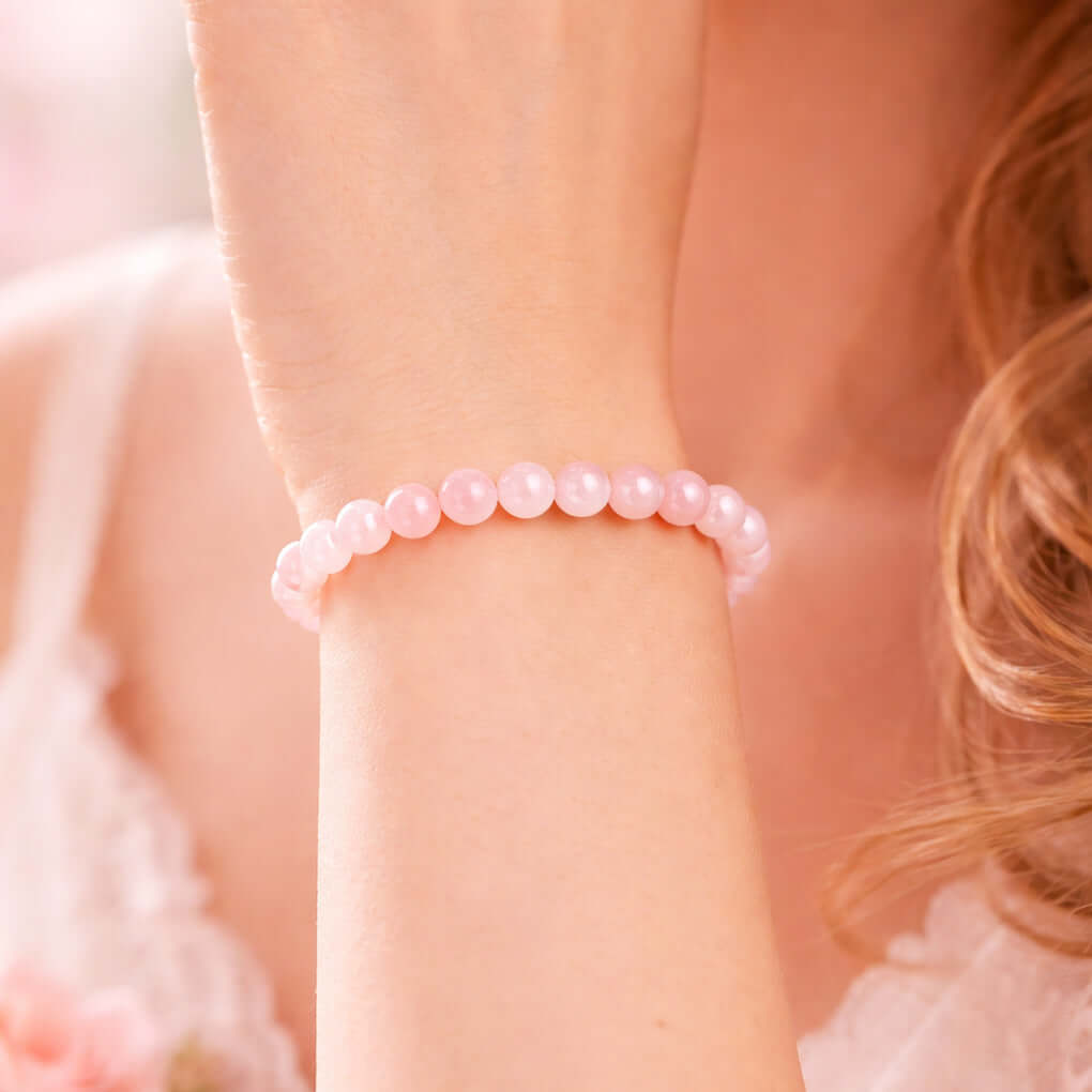 Magnet Rose Quartz Bracelet displayed on a wrist, featuring natural pink Rose Quartz stones symbolizing love and harmony.